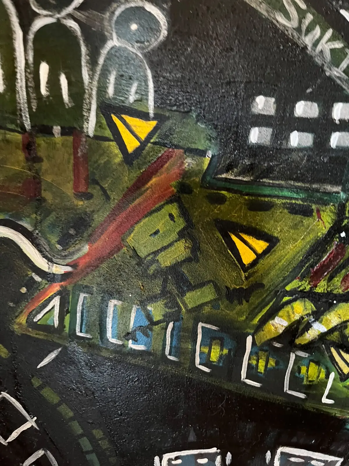 Detail — figure above green and yellow blocks