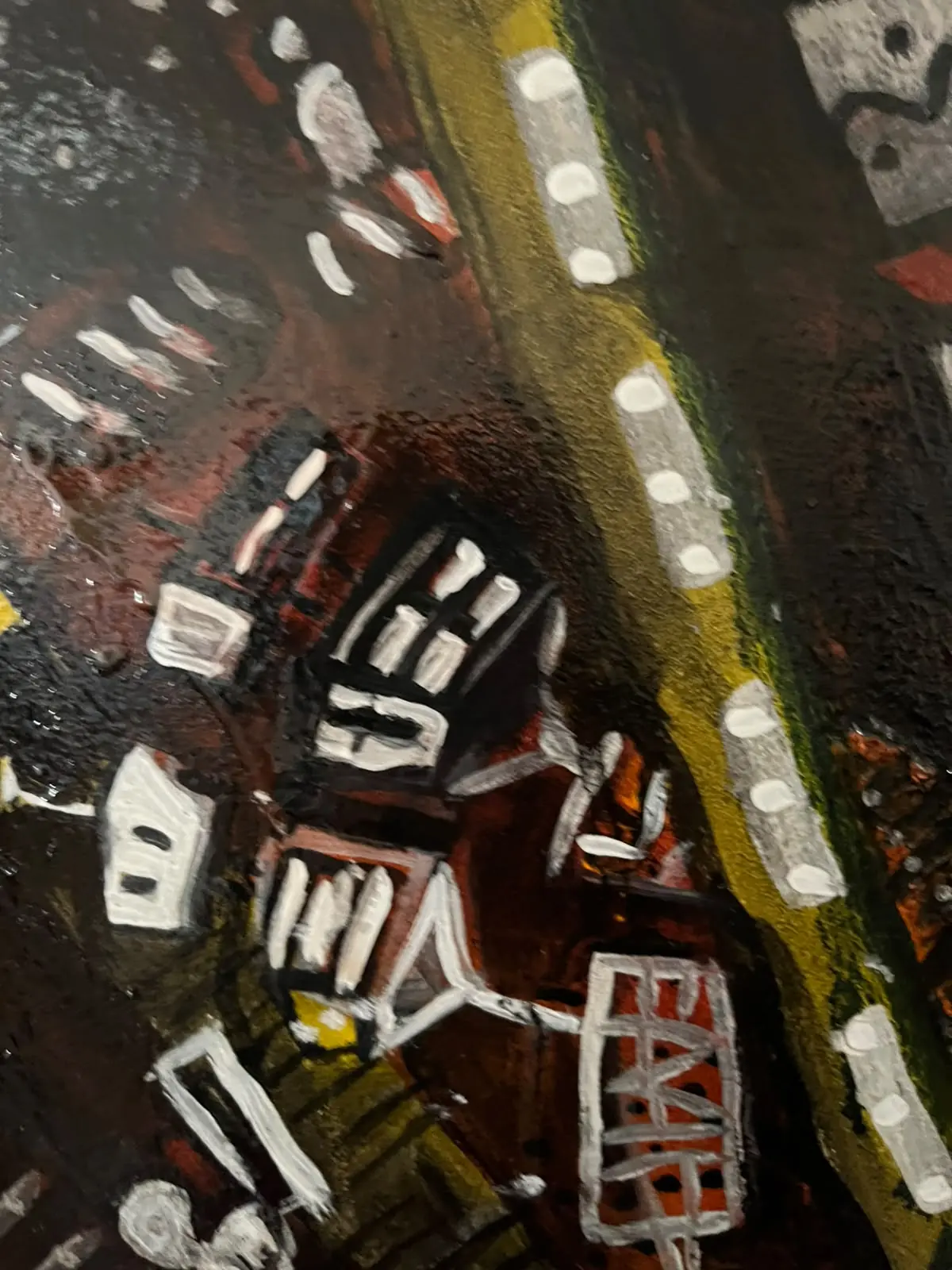 Detail — red buildings along a yellow road with lights